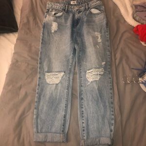 Light wash jeans with rips on the knees